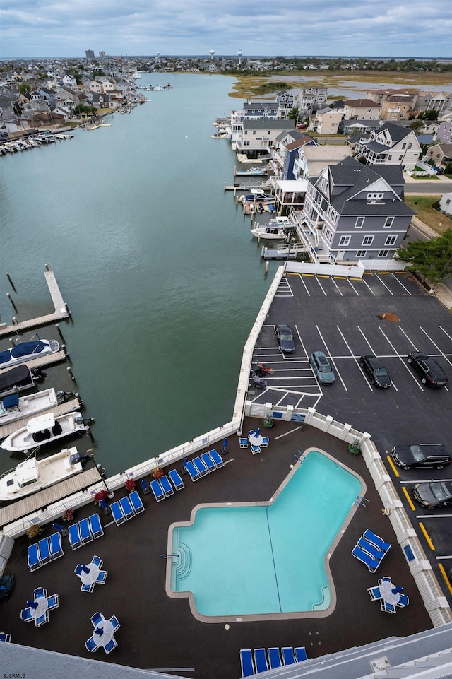 birds eye view of property with a water view