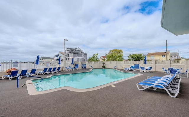 view of swimming pool featuring a patio area