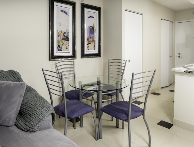 dining area featuring light tile patterned floors