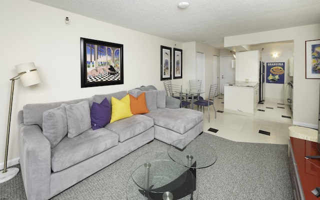 tiled living room with a textured ceiling