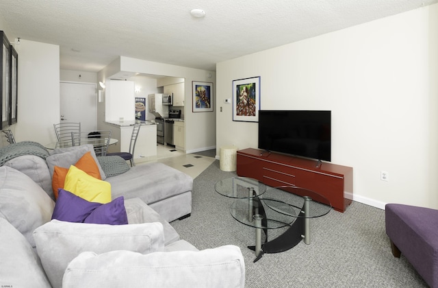 carpeted living room featuring a textured ceiling