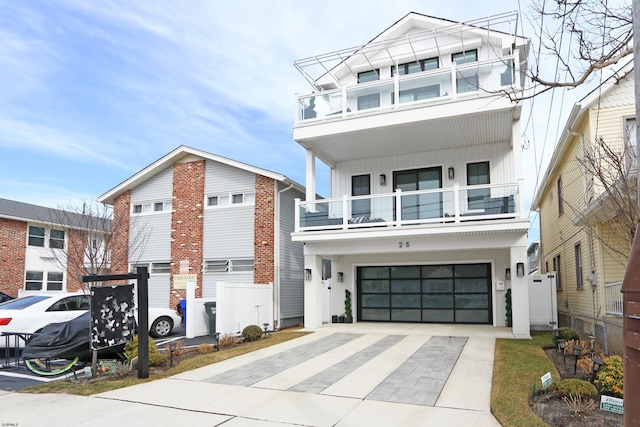 view of front of property with a garage and a balcony