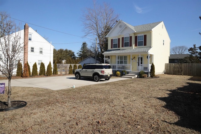 exterior space featuring covered porch and a front lawn