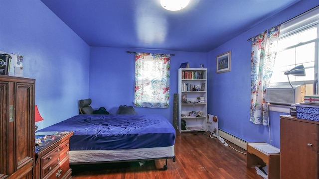 bedroom featuring dark wood-type flooring and baseboard heating