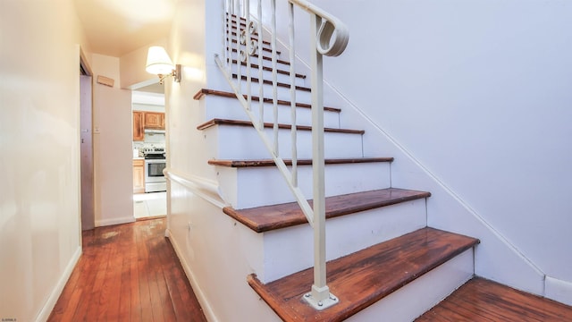 stairway featuring hardwood / wood-style flooring