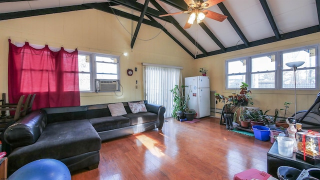 living room featuring cooling unit, hardwood / wood-style floors, and a wealth of natural light