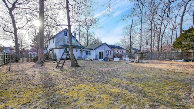 back of property with an outbuilding