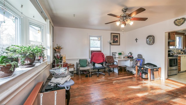 home office featuring hardwood / wood-style flooring and ceiling fan