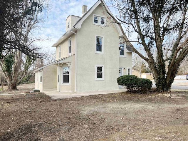 view of home's exterior with a patio area