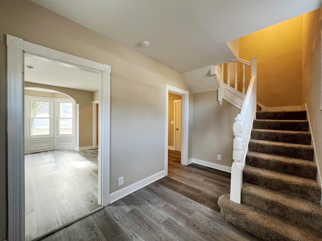 stairway featuring hardwood / wood-style flooring