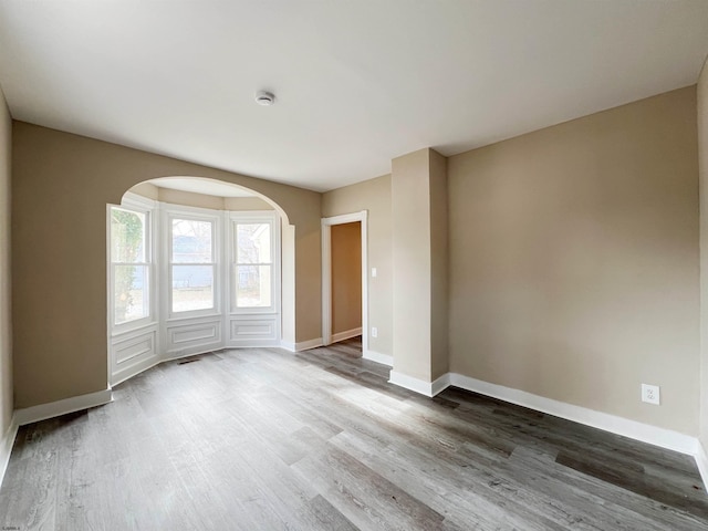 empty room featuring hardwood / wood-style flooring