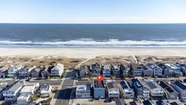 bird's eye view with a view of the beach and a water view