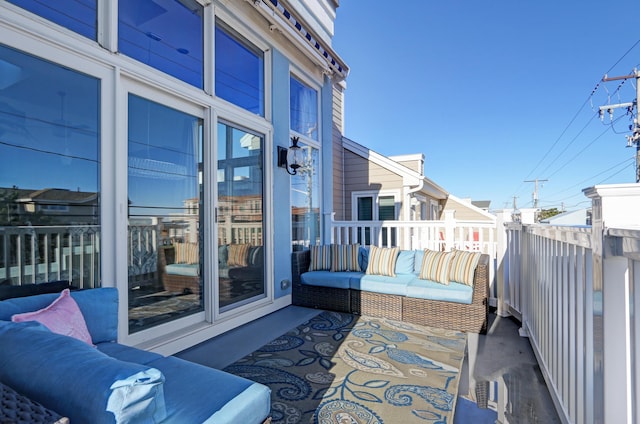 view of patio featuring a balcony and outdoor lounge area