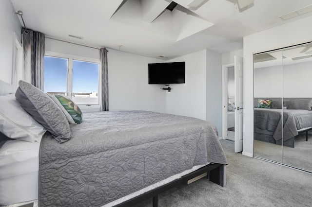 bedroom featuring a closet and carpet