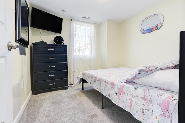 bedroom with light carpet