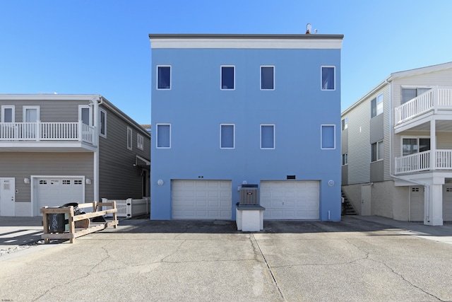 back of house featuring central AC unit