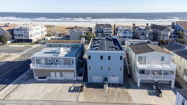 aerial view featuring a water view and a view of the beach