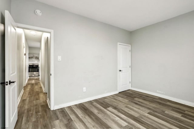 empty room featuring hardwood / wood-style flooring