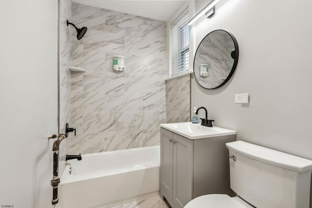 full bathroom featuring vanity, toilet, and tiled shower / bath