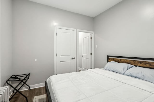 bedroom featuring dark hardwood / wood-style floors