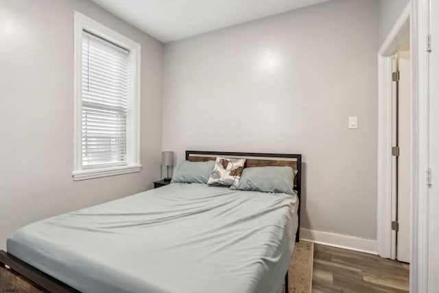 bedroom featuring dark hardwood / wood-style floors