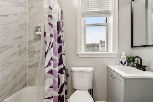 full bathroom with vanity, toilet, and shower / bath combo with shower curtain