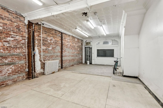 interior space featuring brick wall