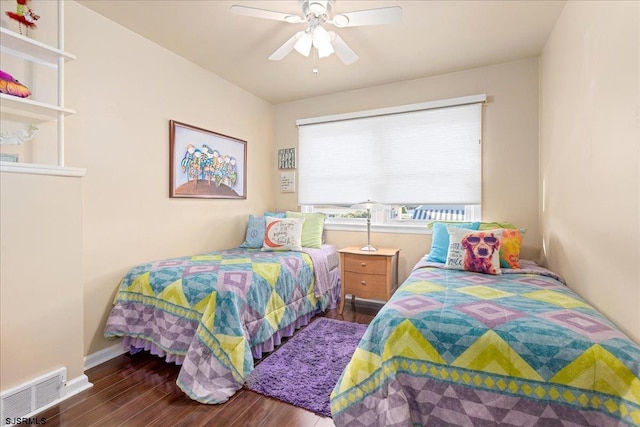 bedroom featuring dark wood-type flooring and ceiling fan