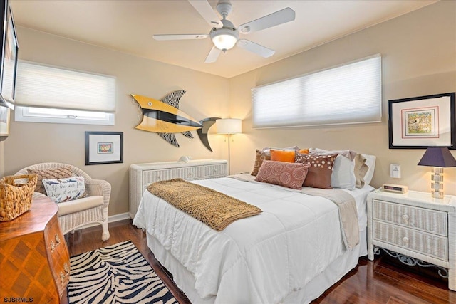 bedroom featuring ceiling fan and dark hardwood / wood-style flooring