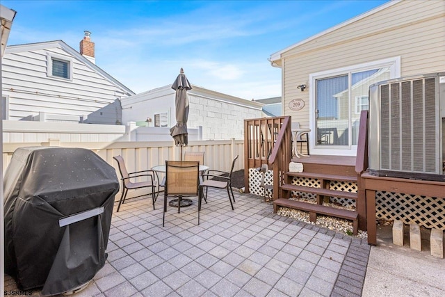 view of patio / terrace featuring area for grilling and central air condition unit