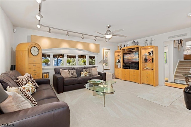 living room featuring ceiling fan and light carpet