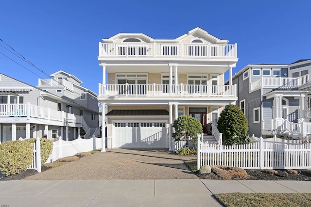 view of front facade featuring a garage and a balcony