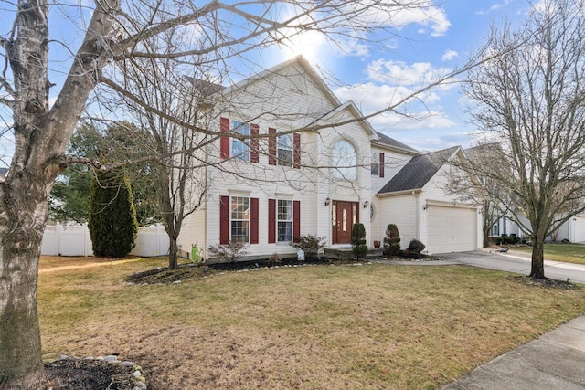 view of front of home featuring a garage and a front yard