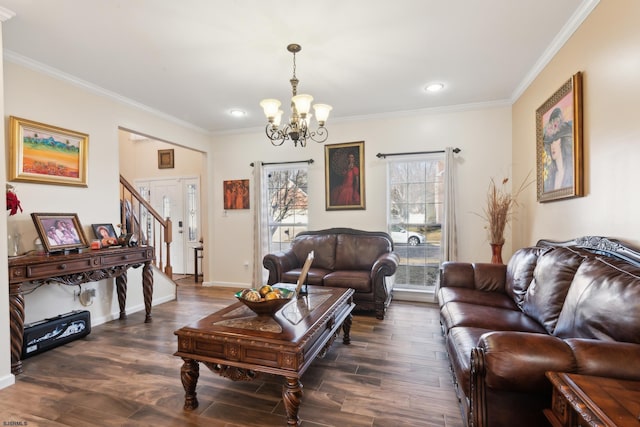 living room with crown molding, dark hardwood / wood-style floors, and a chandelier