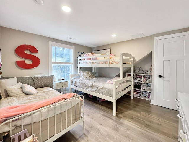 bedroom with hardwood / wood-style floors