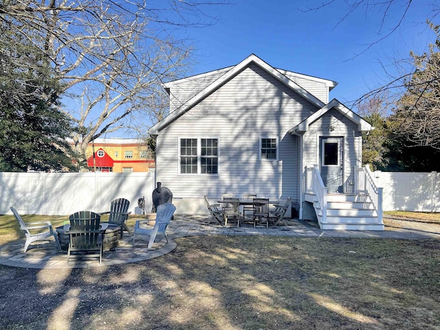 back of house with a patio area and an outdoor fire pit