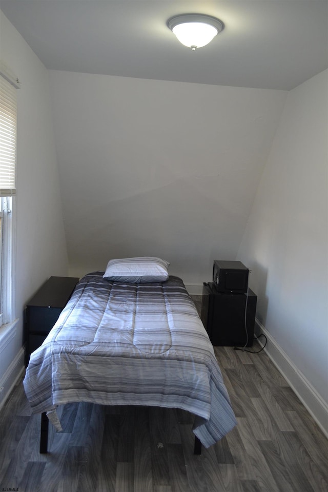 bedroom featuring dark hardwood / wood-style flooring