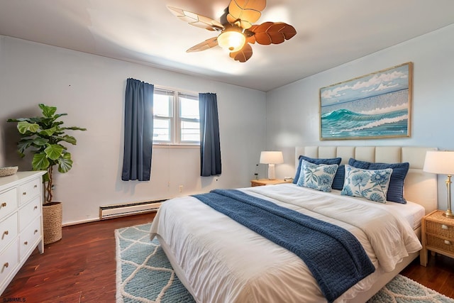 bedroom featuring a baseboard heating unit, dark wood-type flooring, and ceiling fan