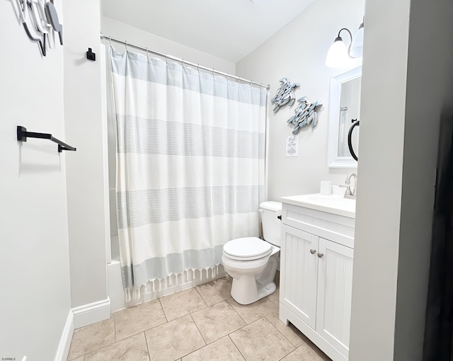 full bathroom featuring vanity, tile patterned floors, toilet, and shower / bath combo with shower curtain