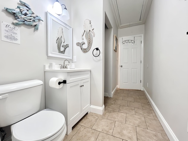 bathroom with vanity, tile patterned floors, and toilet