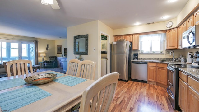 kitchen featuring sink, light hardwood / wood-style flooring, and stainless steel appliances