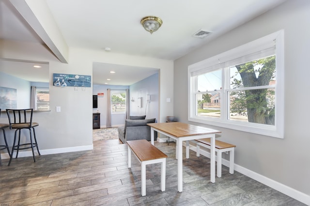 dining area with wood-type flooring