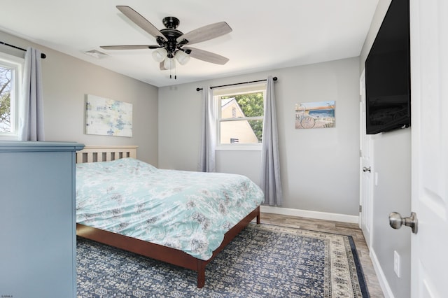 bedroom featuring wood-type flooring and ceiling fan