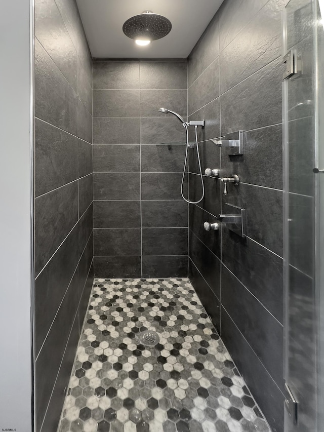 bathroom with tiled shower