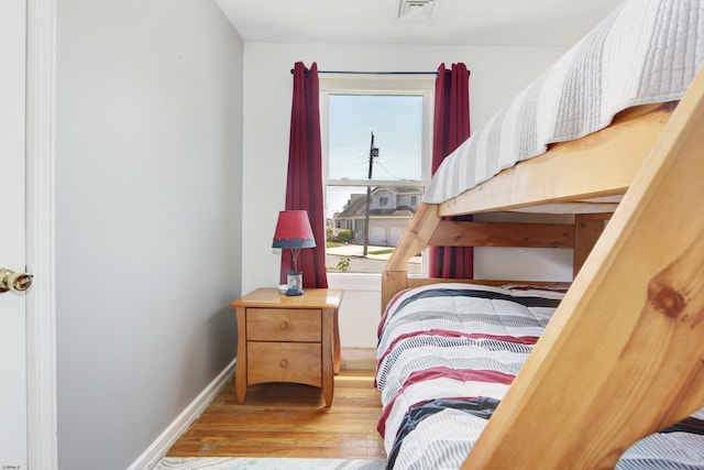 bedroom with light hardwood / wood-style flooring