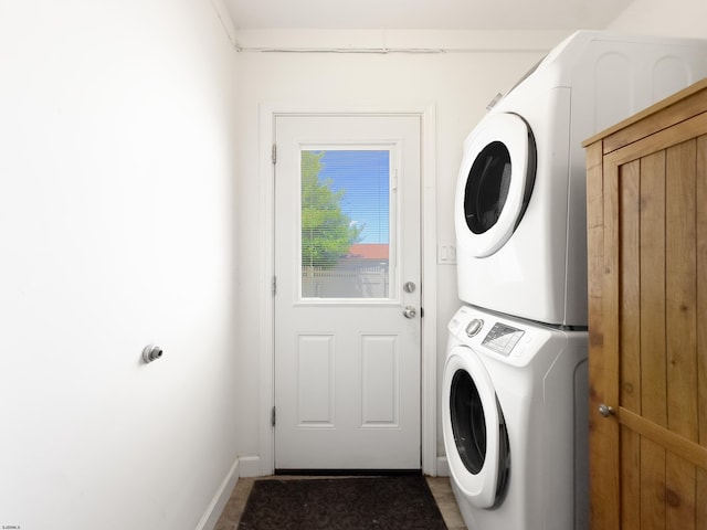 laundry room featuring stacked washer and dryer