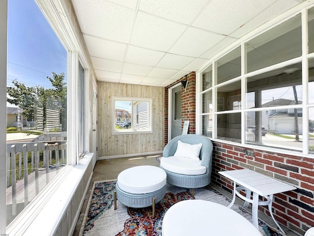 sunroom / solarium with a drop ceiling