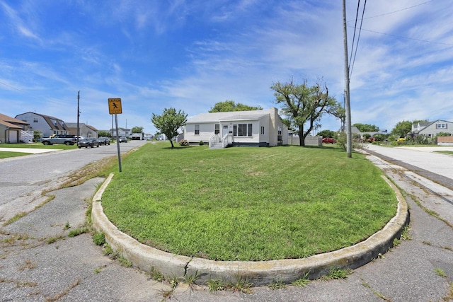 view of front of home with a front lawn