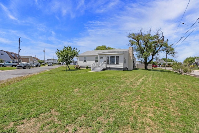 view of front of home with a front yard