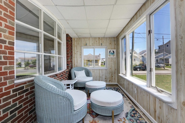 sunroom / solarium featuring a paneled ceiling